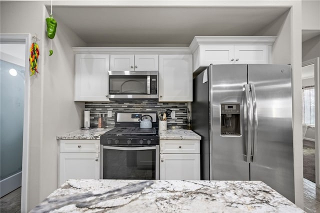 kitchen featuring white cabinets and appliances with stainless steel finishes