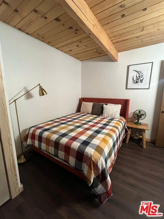 bedroom with wooden ceiling, dark hardwood / wood-style flooring, and beamed ceiling