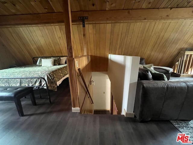 bedroom with wood ceiling, dark hardwood / wood-style flooring, and beamed ceiling