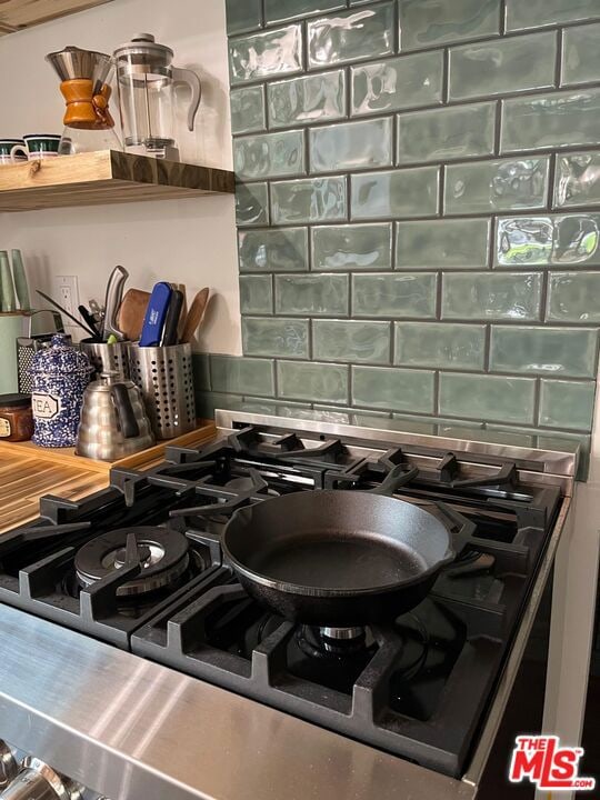 details featuring backsplash and range