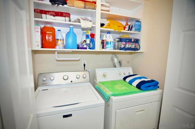 washroom featuring washing machine and dryer