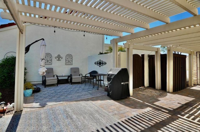 view of patio / terrace featuring area for grilling and a pergola