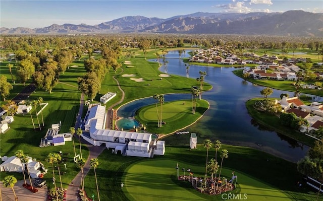 drone / aerial view featuring a water and mountain view