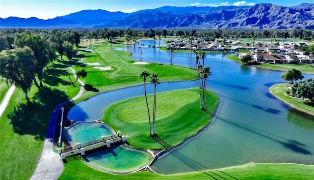 surrounding community featuring a water and mountain view