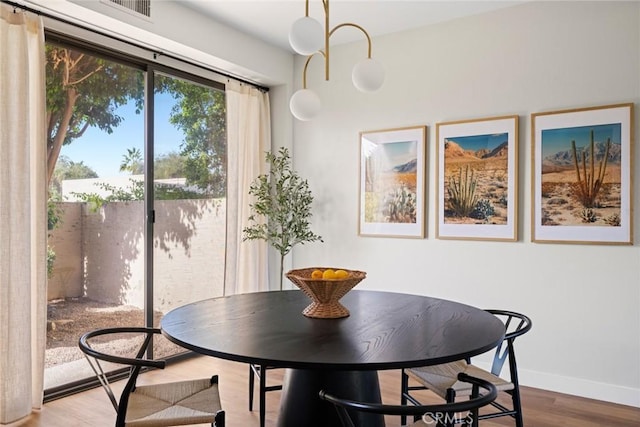 dining space featuring hardwood / wood-style floors