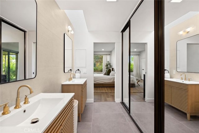 bathroom featuring tile patterned flooring and vanity