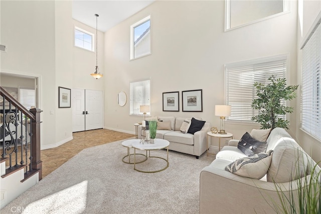 tiled living room with a high ceiling