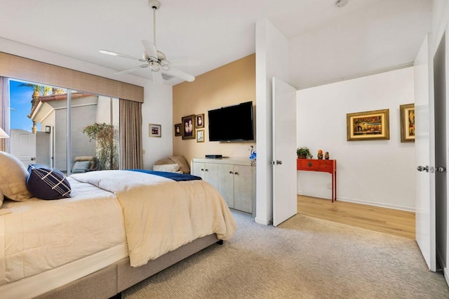 bedroom with ceiling fan and light carpet