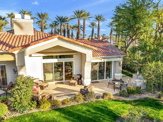 rear view of property featuring a patio area