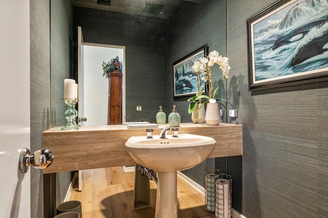 bathroom with sink and hardwood / wood-style floors