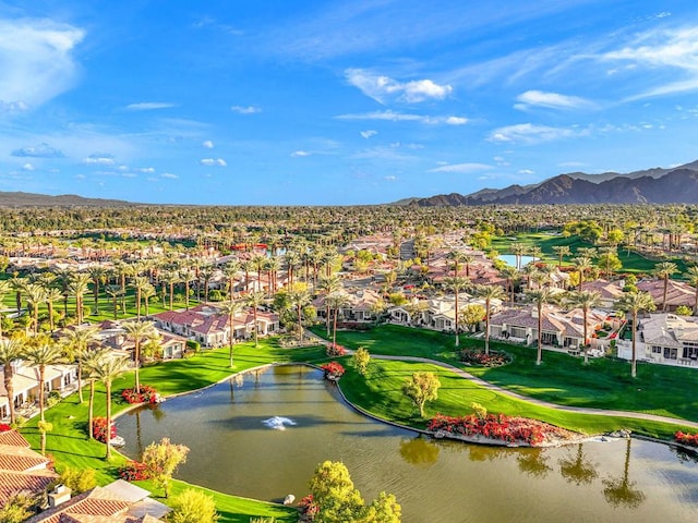 bird's eye view with a water and mountain view