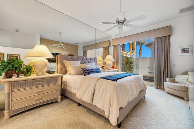 bedroom with ceiling fan and light colored carpet