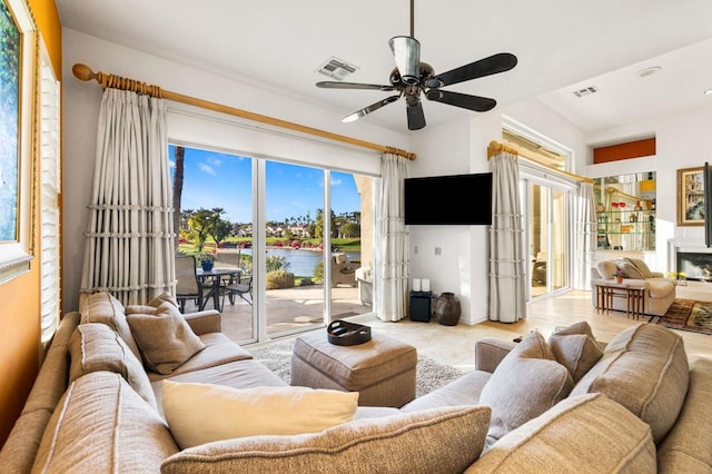 living room with ceiling fan and french doors