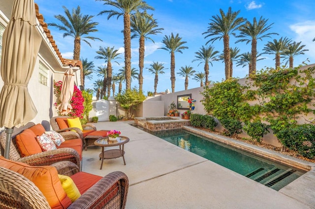 view of swimming pool with an outdoor hangout area, an in ground hot tub, and a patio