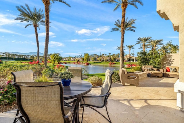 view of patio featuring an outdoor hangout area and a water and mountain view