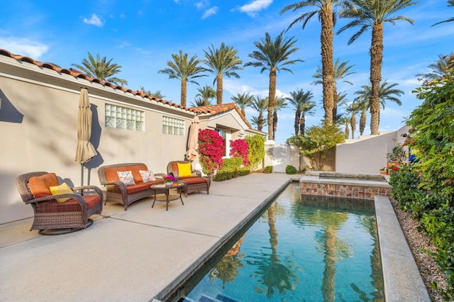 view of pool featuring a patio