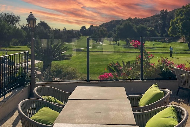 view of patio terrace at dusk