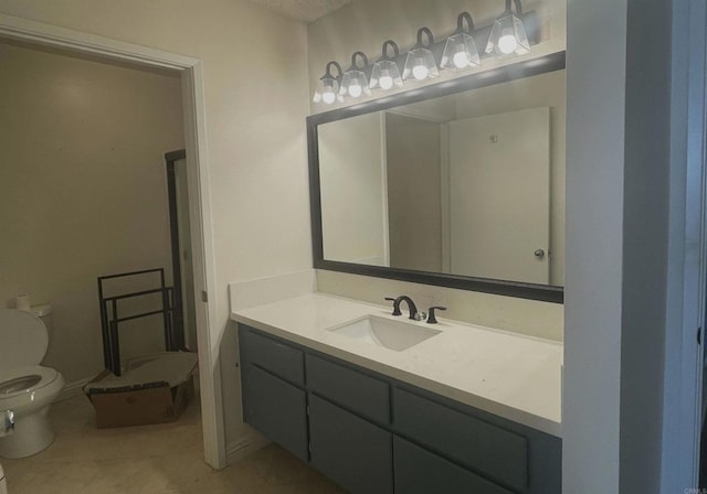 bathroom with vanity, tile patterned floors, and toilet