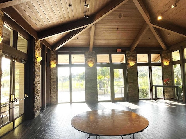 unfurnished sunroom featuring beamed ceiling and wooden ceiling