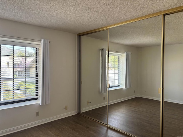 4115 Cyprus Island Ct, Fallbrook, CA 92028 - unfurnished bedroom featuring wood finished floors, a textured ceiling, baseboards, and a closet