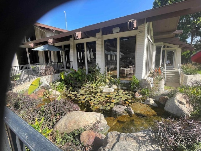 4115 Cyprus Island Ct, Fallbrook, CA 92028 - rear view of house featuring a garden pond