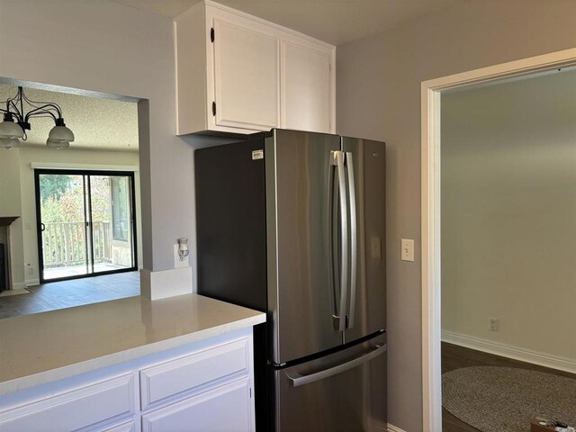 4115 Cyprus Island Ct, Fallbrook, CA 92028 - kitchen featuring freestanding refrigerator, white cabinets, light countertops, baseboards, and wood finished floors