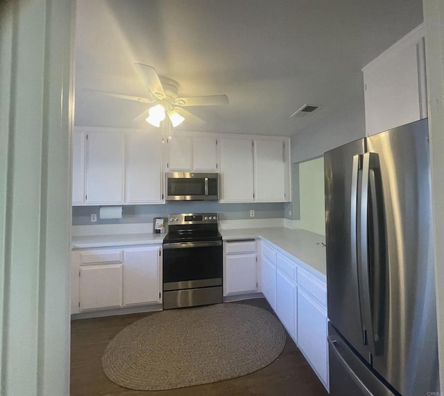 4115 Cyprus Island Ct, Fallbrook, CA 92028 - kitchen featuring stainless steel appliances, light countertops, white cabinetry, a ceiling fan, and dark wood-style flooring
