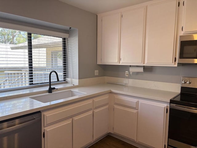 4115 Cyprus Island Ct, Fallbrook, CA 92028 - kitchen with stainless steel appliances, a sink, light countertops, and white cabinetry