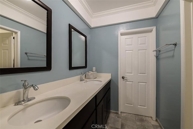 bathroom featuring ornamental molding and vanity