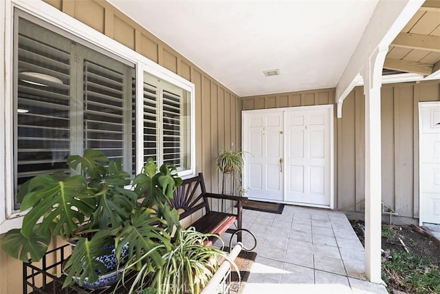 doorway to property featuring covered porch