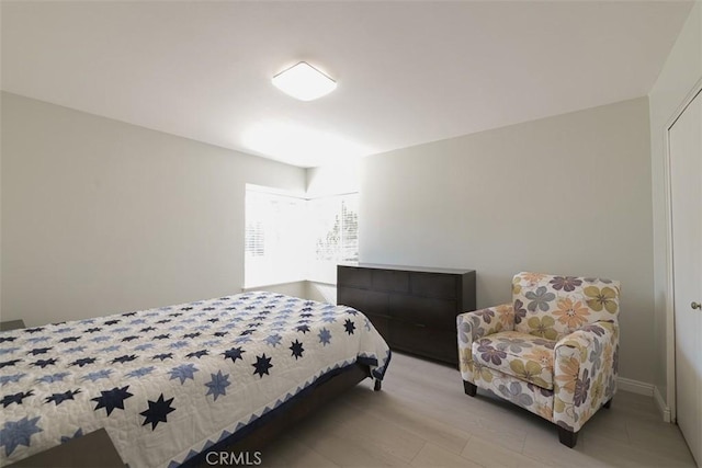 bedroom with light hardwood / wood-style flooring