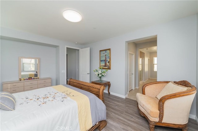 bedroom with hardwood / wood-style floors