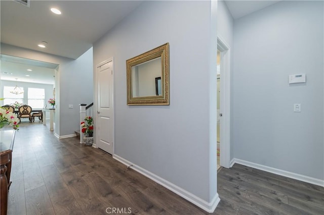 hallway featuring dark wood-type flooring