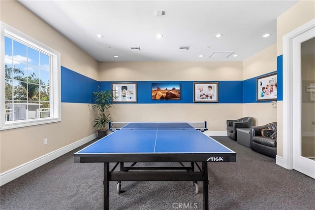 game room featuring dark colored carpet