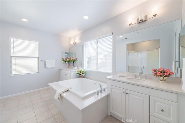 bathroom featuring tile patterned floors, separate shower and tub, and vanity