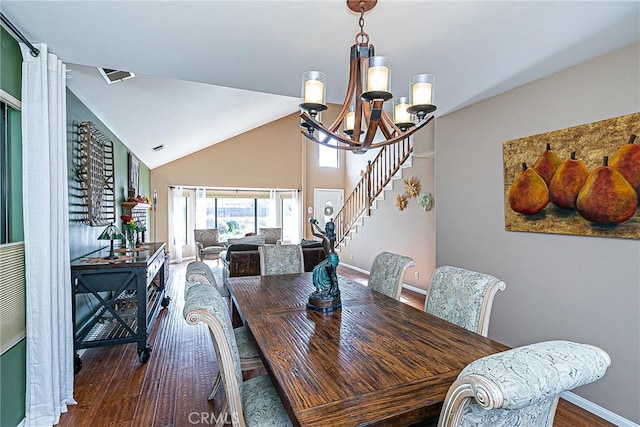 dining area featuring vaulted ceiling, a notable chandelier, and dark hardwood / wood-style floors