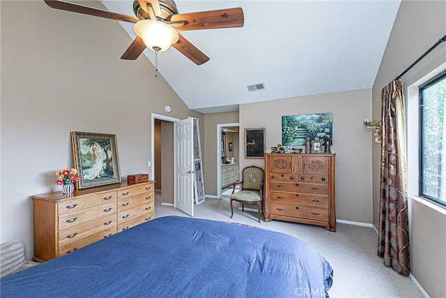 bedroom featuring ceiling fan, light colored carpet, multiple windows, and high vaulted ceiling