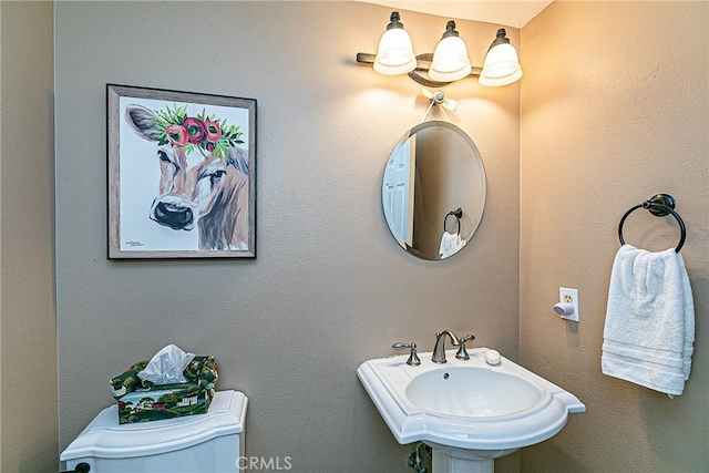 bathroom with toilet and sink