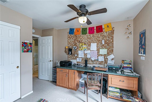 office area with light carpet and ceiling fan