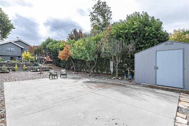 view of patio featuring a storage shed