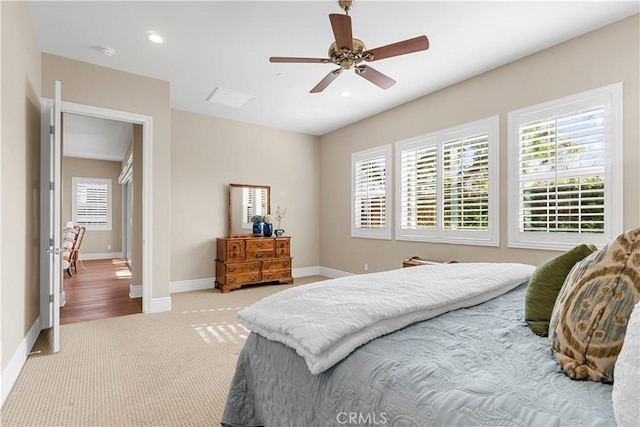 bedroom featuring ceiling fan and light carpet