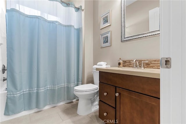 bathroom featuring tile patterned floors, vanity, toilet, and a shower with shower curtain