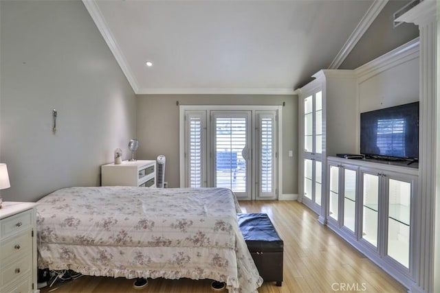 bedroom with light hardwood / wood-style flooring and crown molding