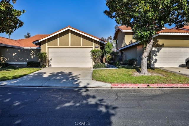 view of front of house with a front lawn and a garage