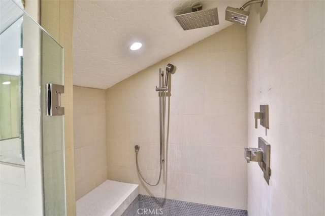 bathroom with a tile shower