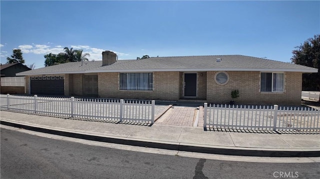 ranch-style home featuring a garage