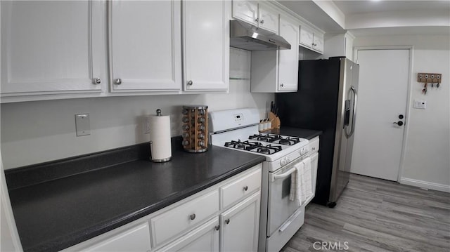 kitchen featuring stainless steel refrigerator with ice dispenser, white cabinets, white gas stove, and light wood-type flooring