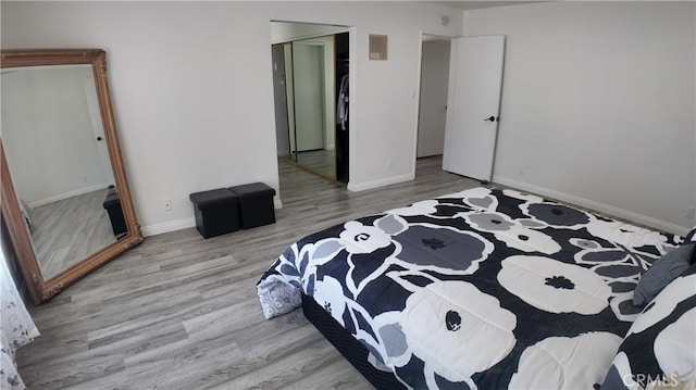 bedroom featuring a closet and light hardwood / wood-style floors