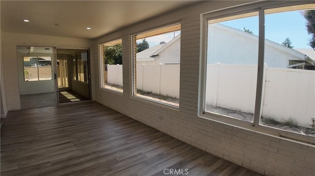 unfurnished sunroom featuring plenty of natural light