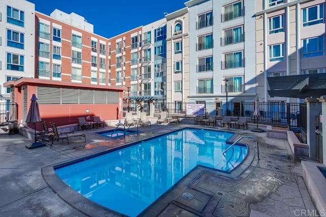 view of swimming pool featuring a patio area